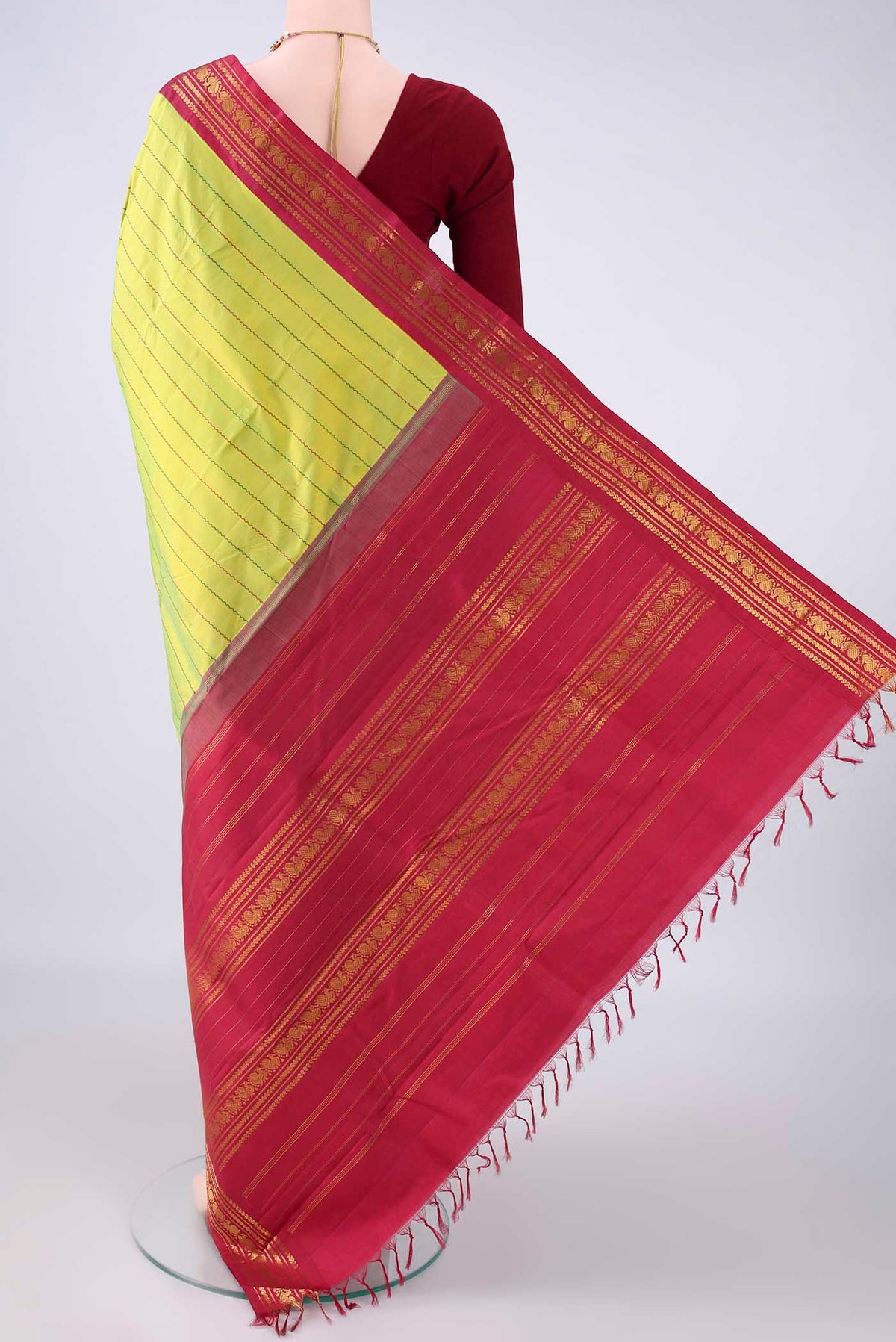 Flat view of Pure Silk Parrot Green Kanchipuram Saree with Veldhari on the body and Zari Border. 