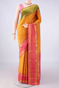 Pure Silk Mustard Kanchipuram Saree with Veldhari on the body and Ganga Jamuna Border.  displayed on a mannequin