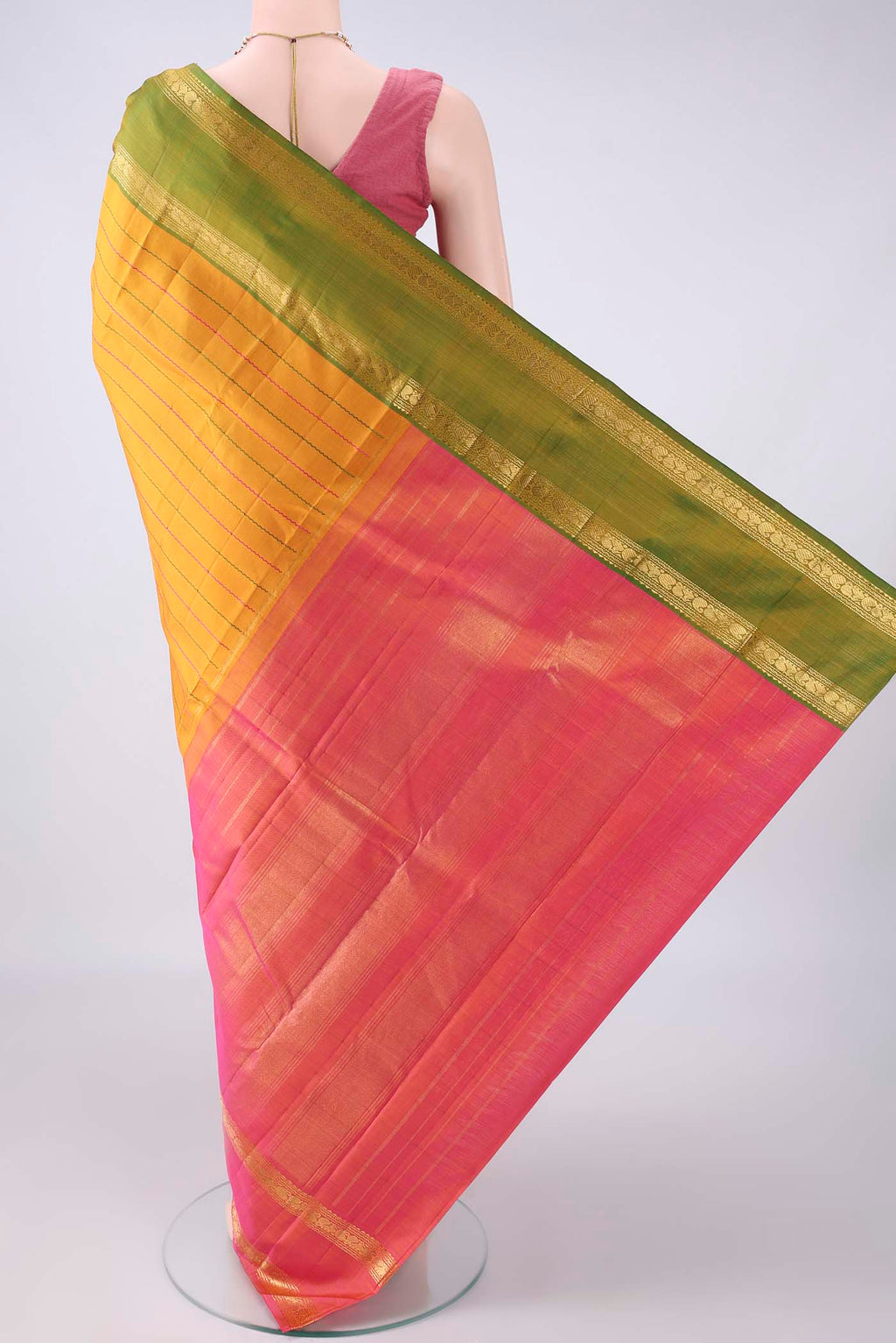 Flat view of Pure Silk Mustard Kanchipuram Saree with Veldhari on the body and Ganga Jamuna Border. 