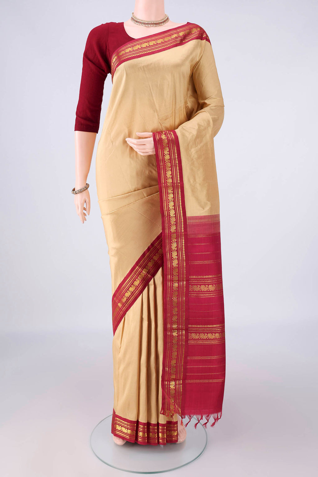 Pure Silk Sandal Kanchipuram Saree with Plain Body and Zari Border.  displayed on a mannequin