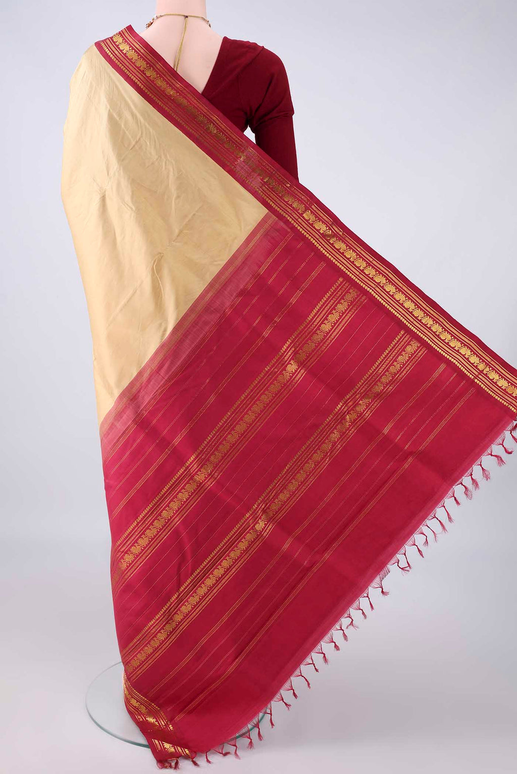 Flat view of Pure Silk Sandal Kanchipuram Saree with Plain Body and Zari Border. 