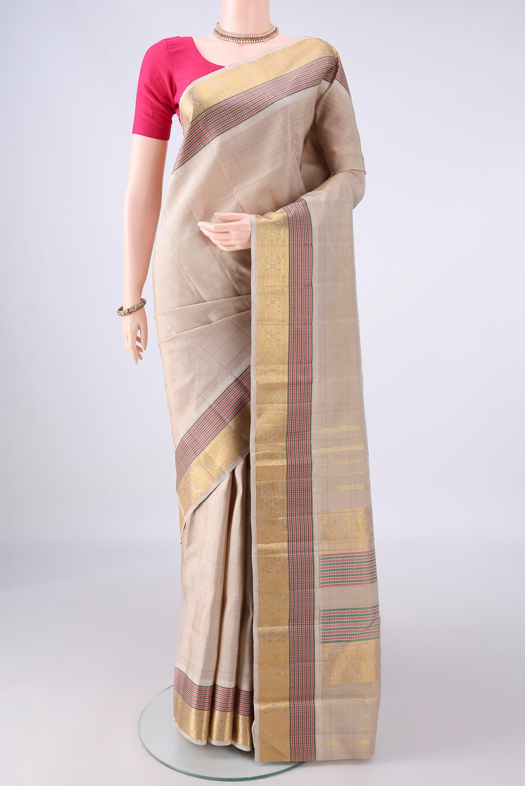 Pure Silk Dark Beige Kanchipuram Saree with Plain Body and Zari Border.  displayed on a mannequin