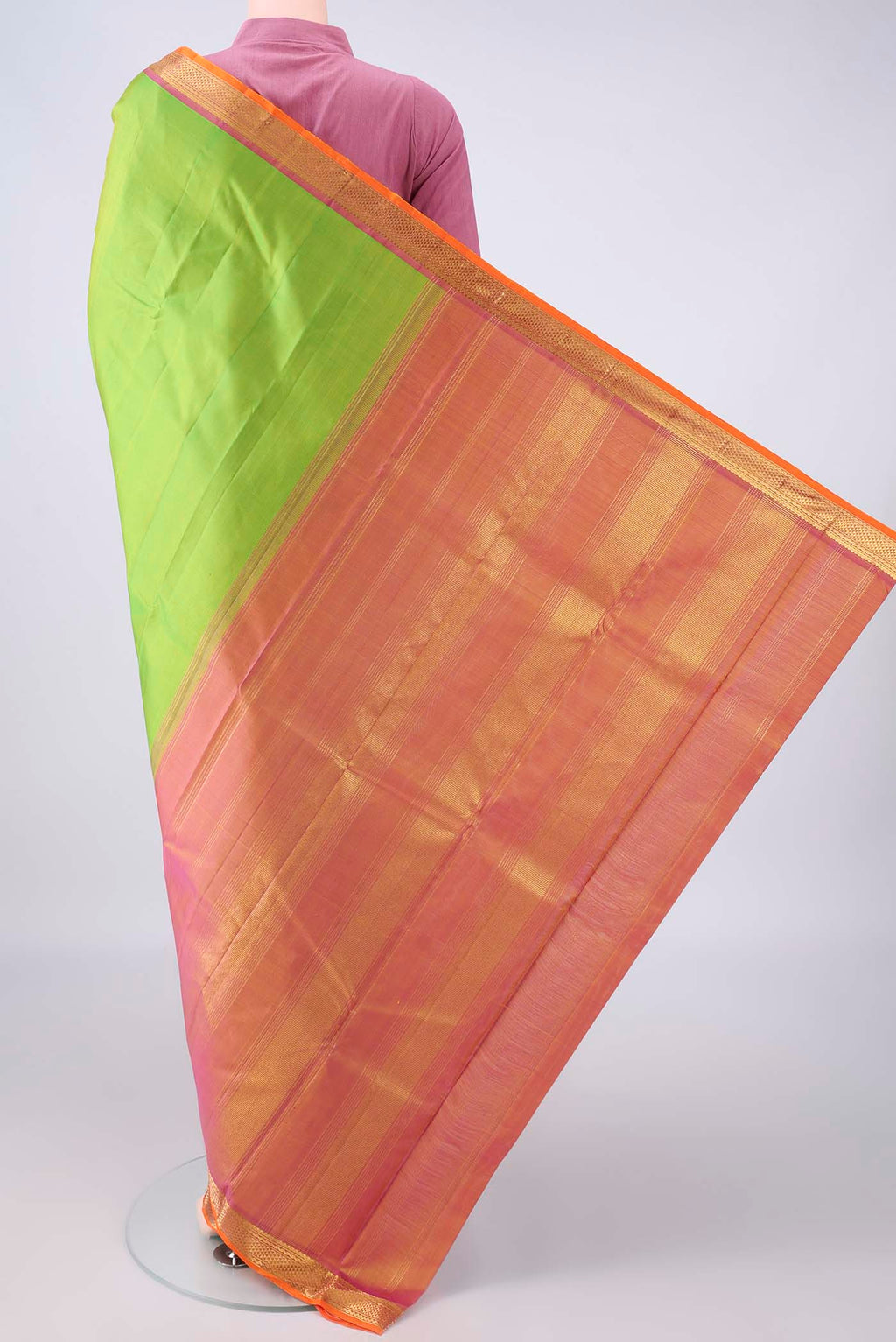 Flat view of Pure Silk Parrot Green Kanchipuram Saree with Plain Body and Zari Border. 