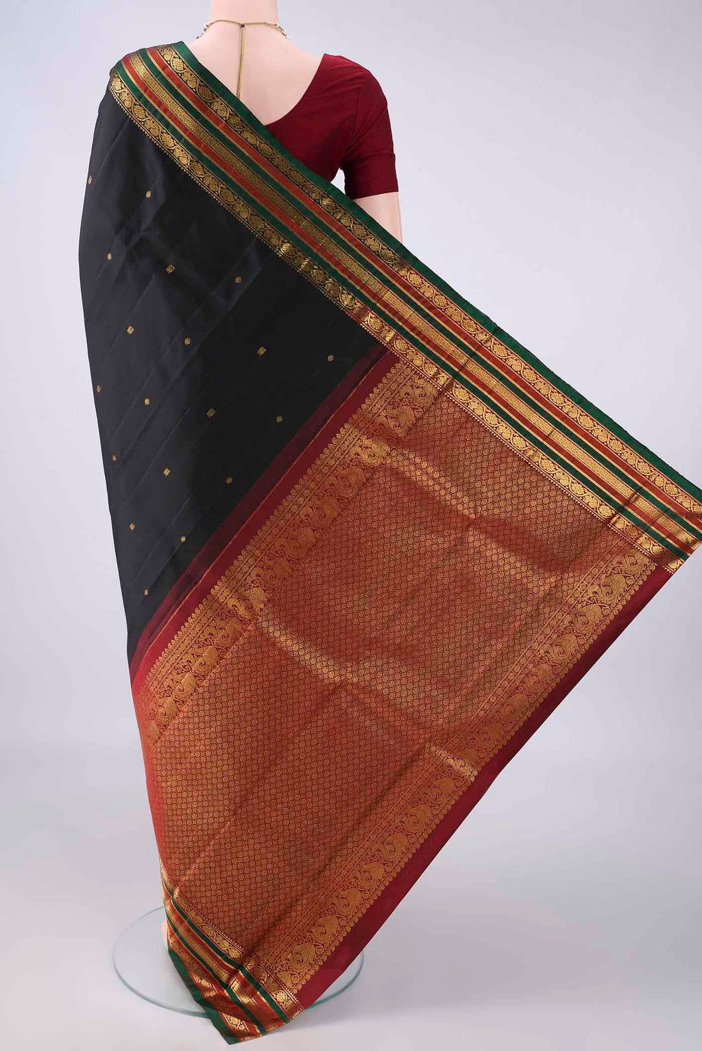 Flat view of Pure Silk Black Kanjivaram Saree with Zari Butta on the body and Zari Border. 