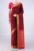 Pure Silk Maroon Kanjivaram Saree with Zari Butta on the body and Zari Border.  displayed on a mannequin