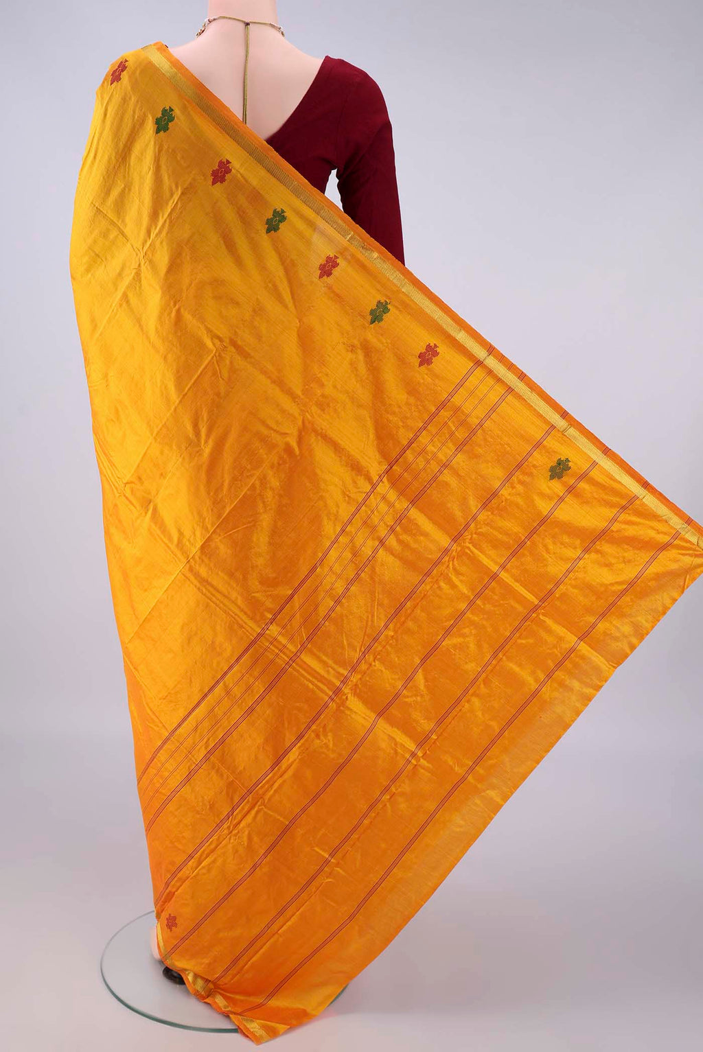 Flat view of Pure Silk Yellow Kanchipuram Saree with Plain Body and Zari Border. 