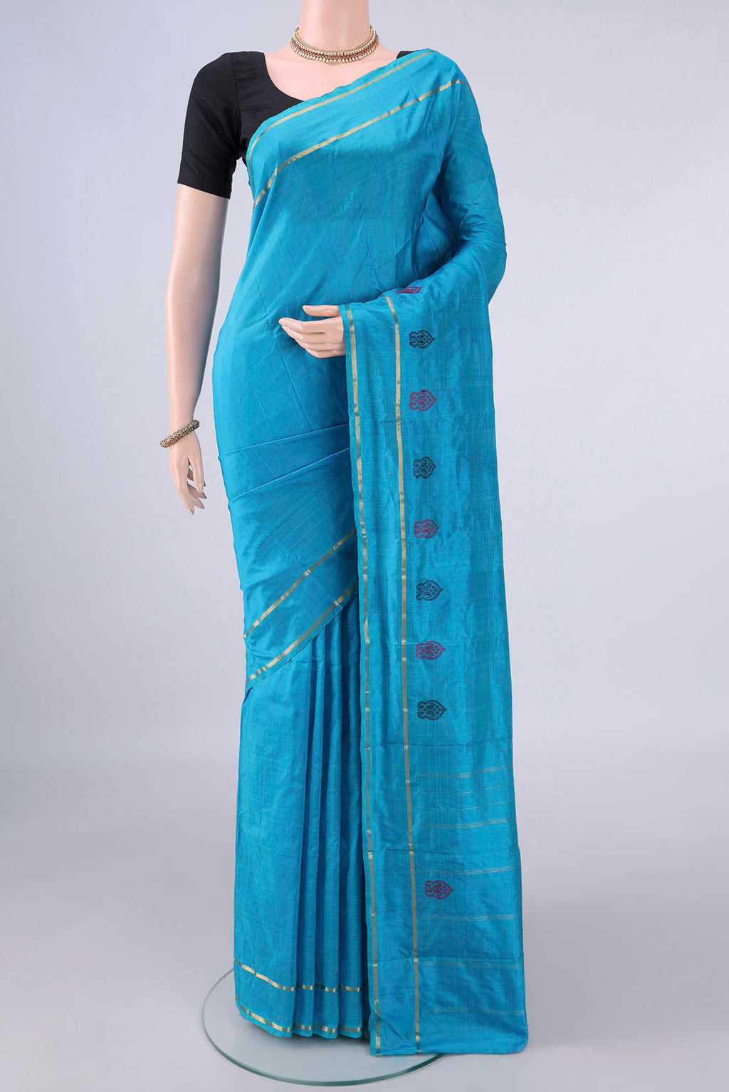 Pure Silk Blue Kanchipuram Saree with Plain Body and Zari Border.  displayed on a mannequin