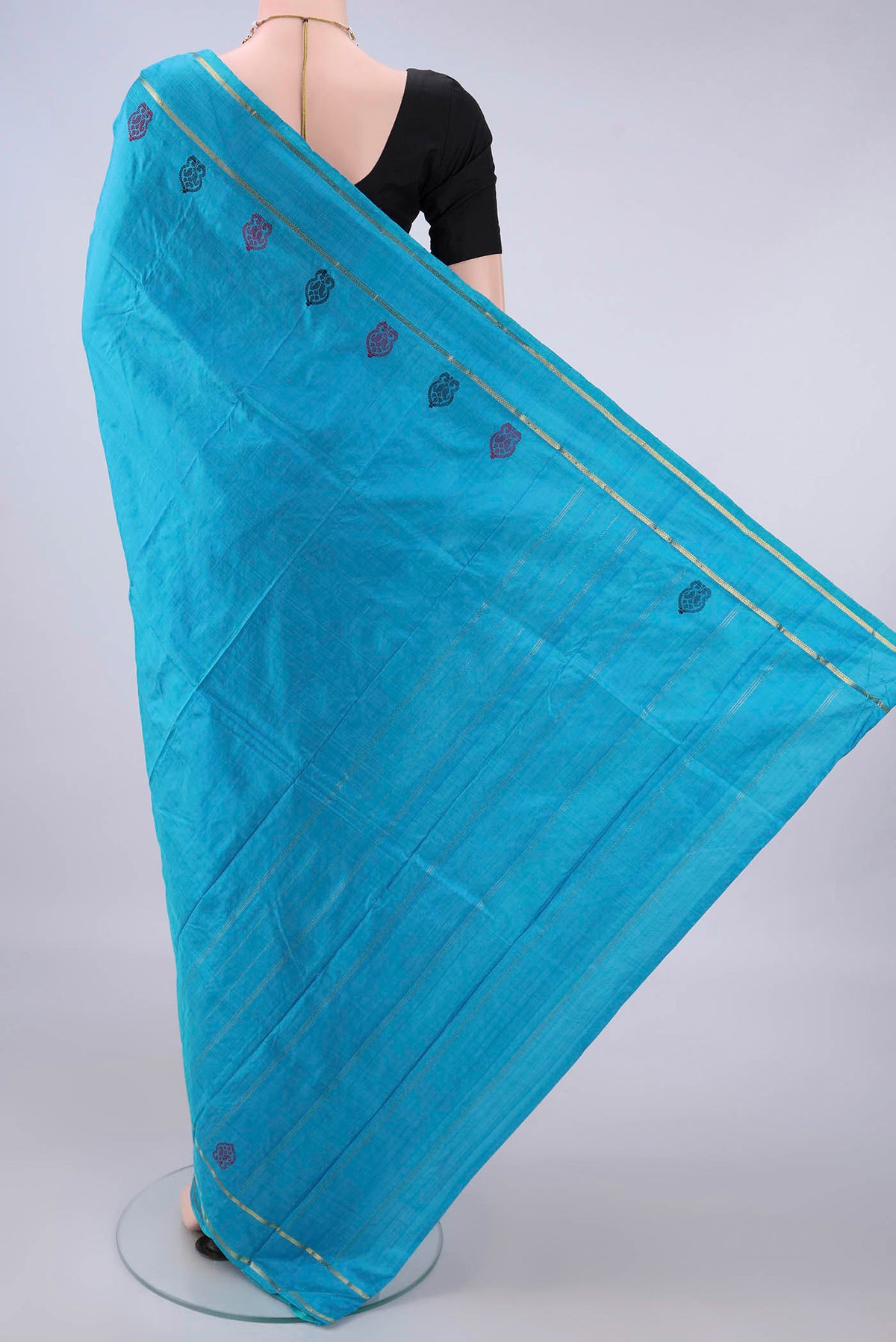Flat view of Pure Silk Blue Kanchipuram Saree with Plain Body and Zari Border. 