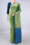 Pure Silk Light Green Kanchipuram Saree with Plain Body and Zari Border.  displayed on a mannequin