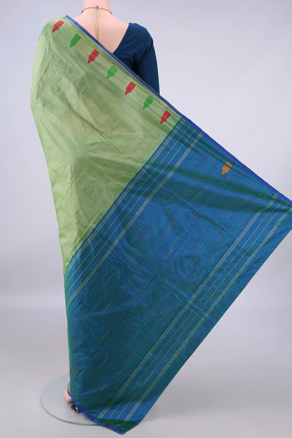 Flat view of Pure Silk Light Green Kanchipuram Saree with Plain Body and Zari Border. 