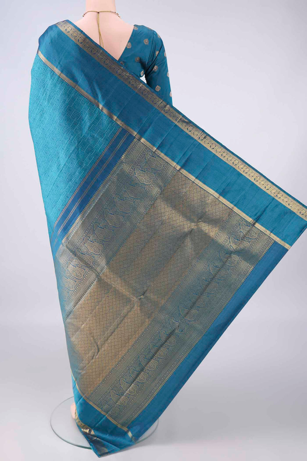 Flat view of Pure Silk Blue Kanjivaram Saree with Jacquard design on the body and Zari Border. 