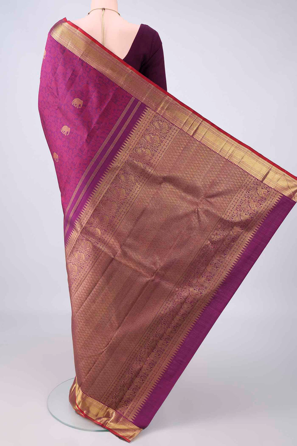 Flat view of Pure Silk Purple Kanchipuram Saree with Jacquard With Zari Butta on the body and Zari Border. 