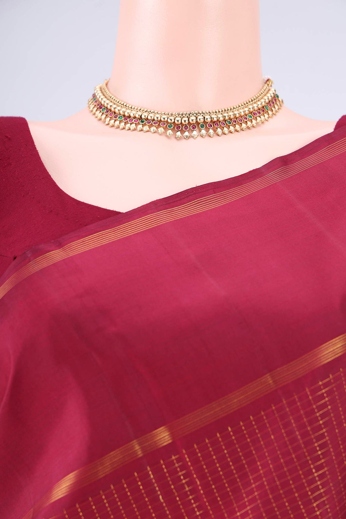 Border image of Pure Silk Maroon Kanjivaram Saree with Checked design on the body and Zari Border. 
