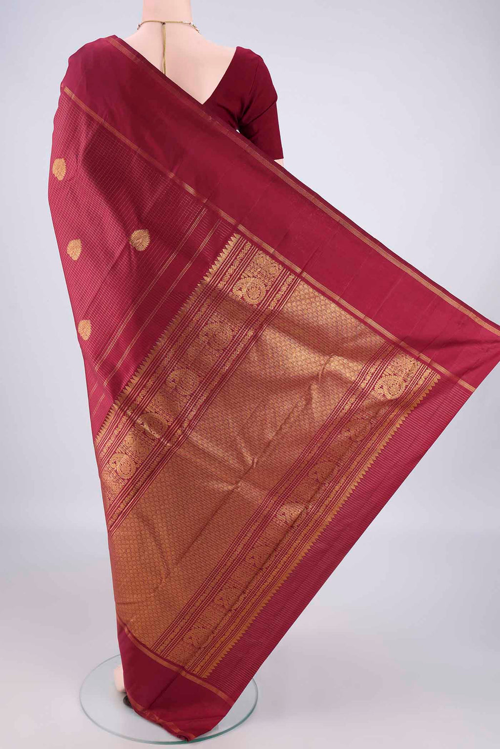 Flat view of Pure Silk Maroon Kanjivaram Saree with Checked design on the body and Zari Border. 