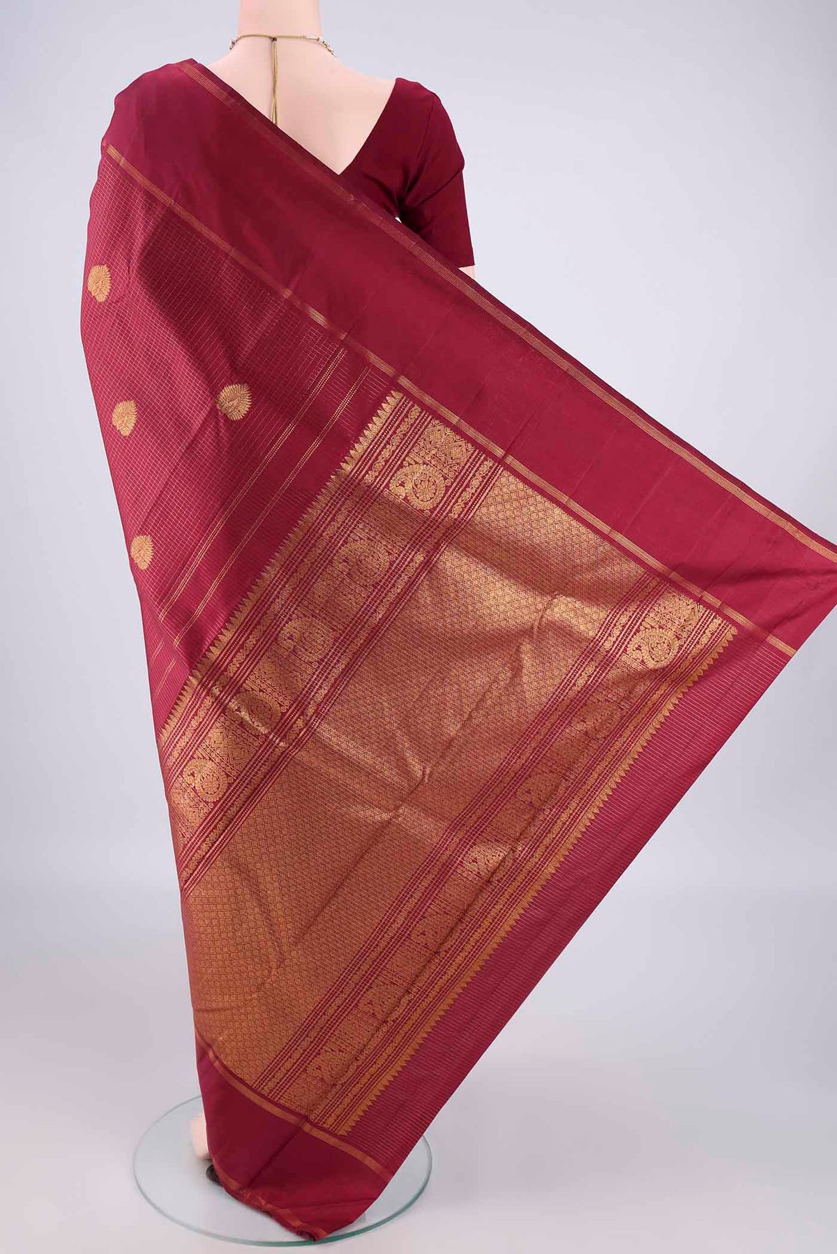 Flat view of Pure Silk Maroon Kanjivaram Saree with Checked design on the body and Zari Border. 