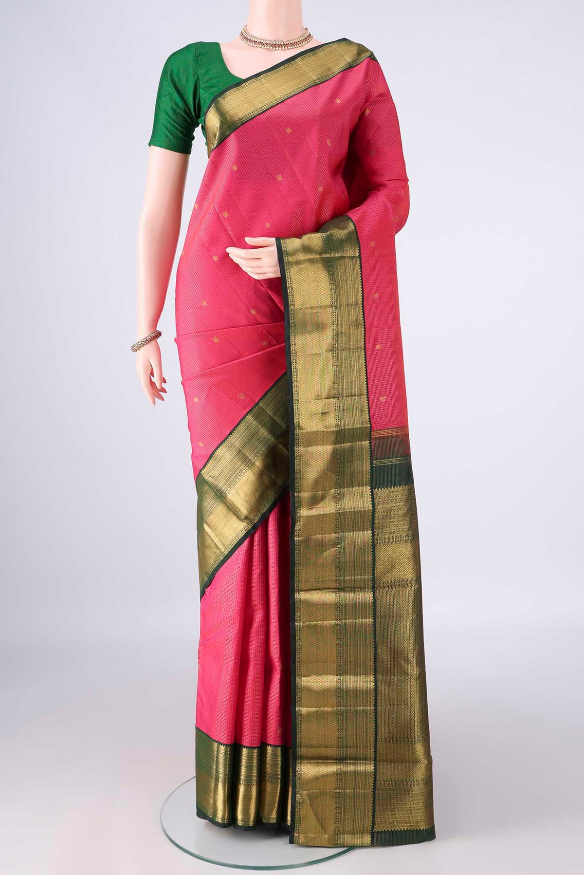 Pure Silk Pure Zari Dark Pink Kanchipuram Saree with Checked design on the body and Zari Border.  displayed on a mannequin