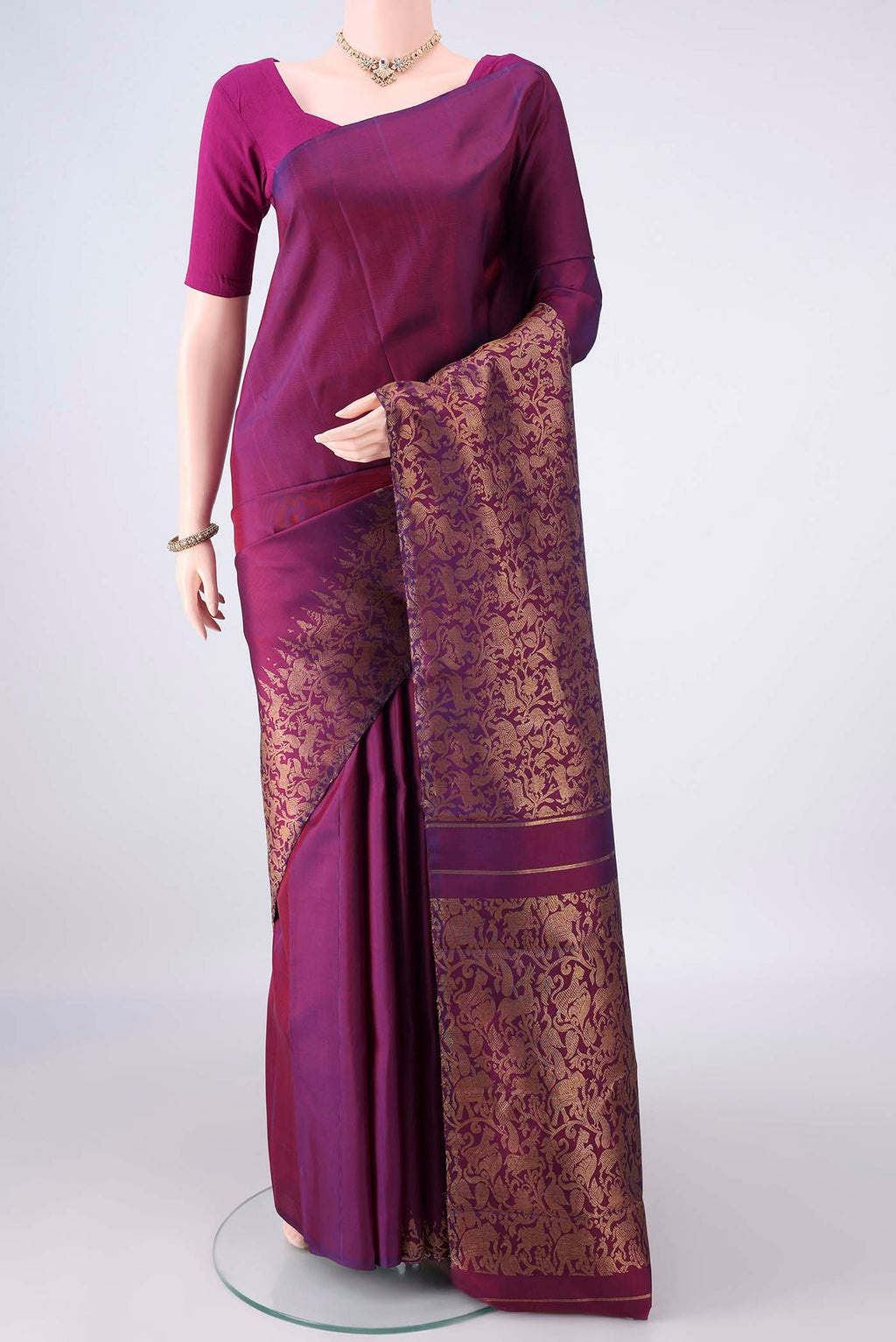 Pure Silk Pure Zari Purple Kanjivaram Saree with Plain Body and Fancy Border.  displayed on a mannequin