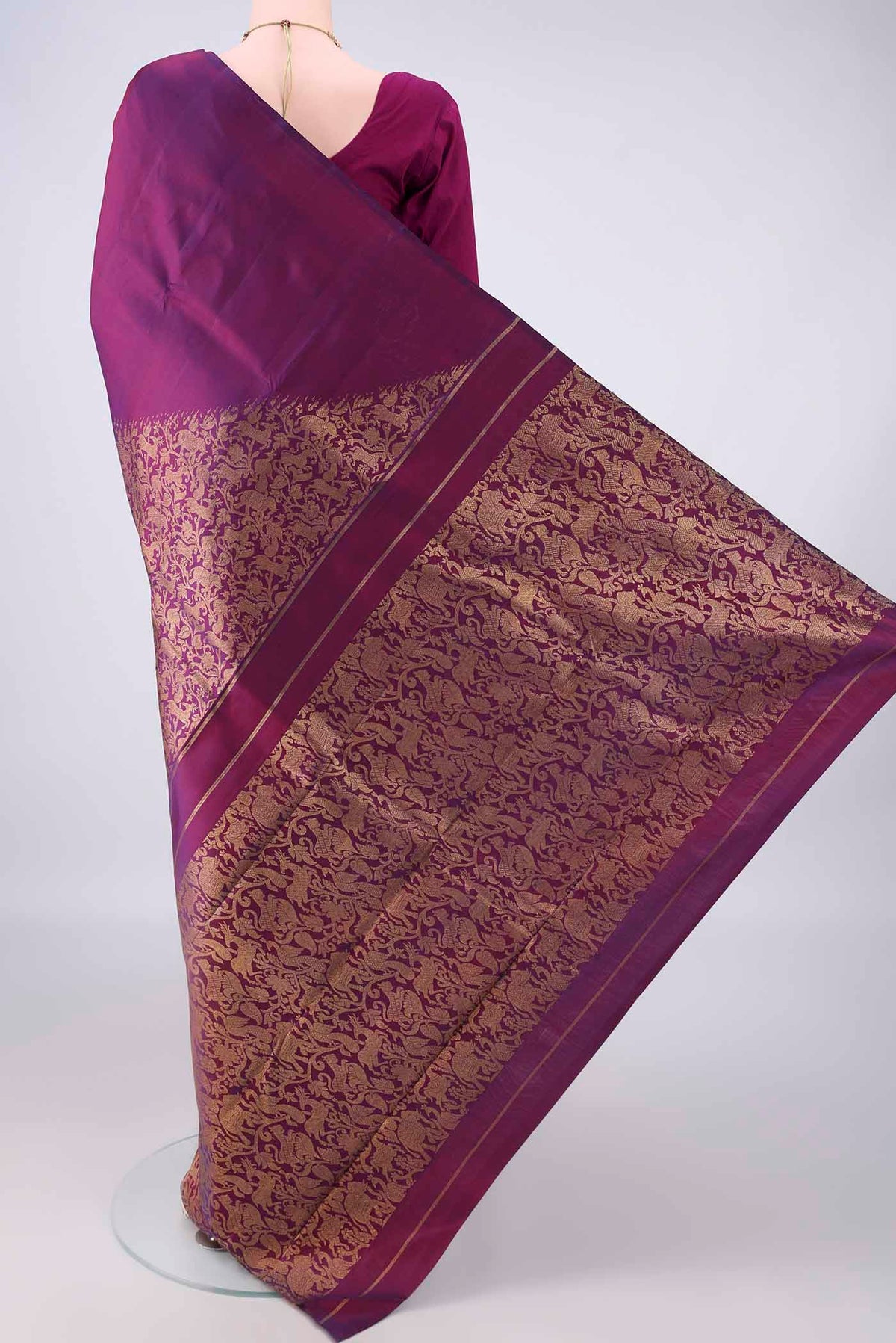 Flat view of Pure Silk Pure Zari Purple Kanjivaram Saree with Plain Body and Fancy Border. 