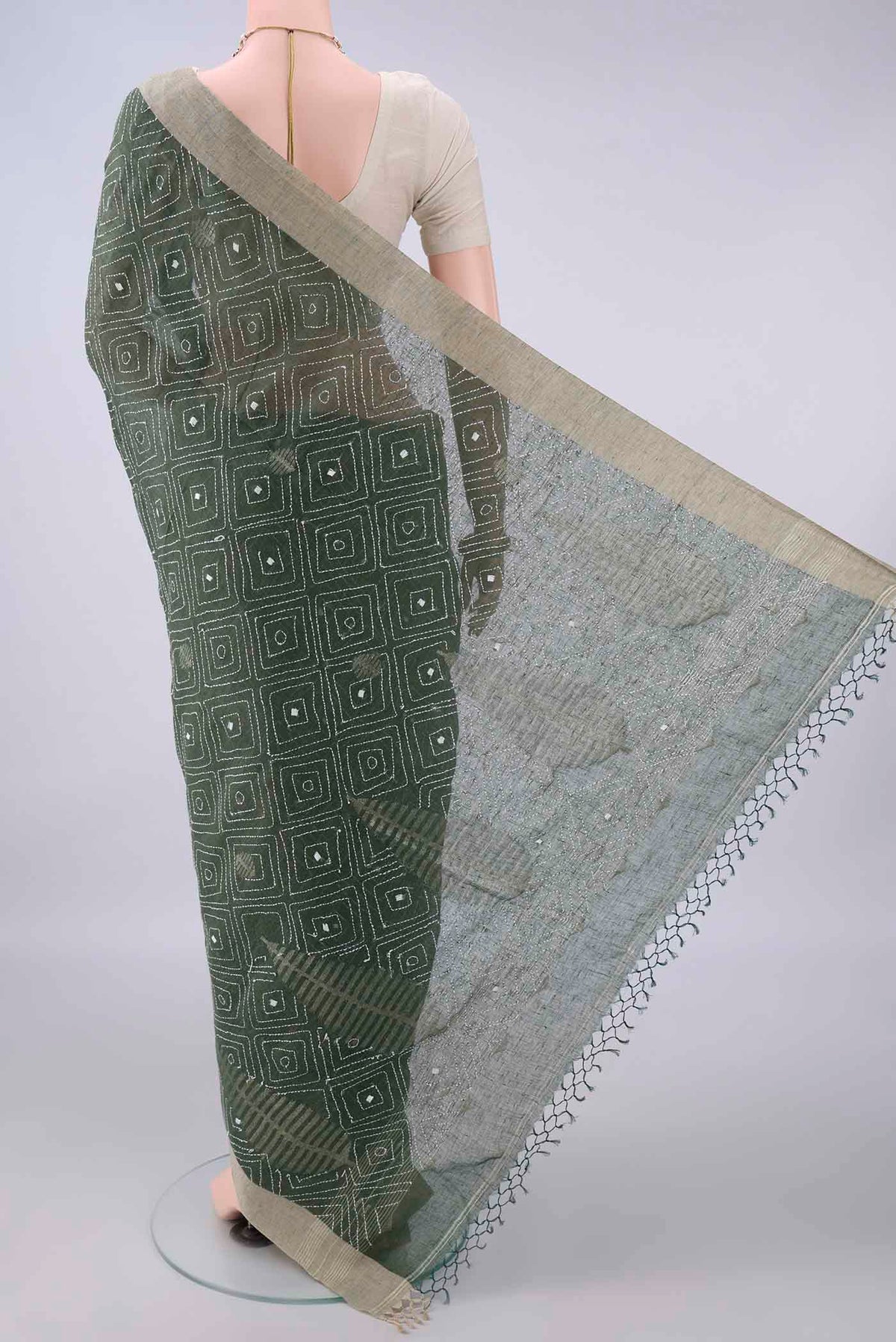 Flat view of Olive Green Linen Saree with Kantha Work on the body and Plain Border. 