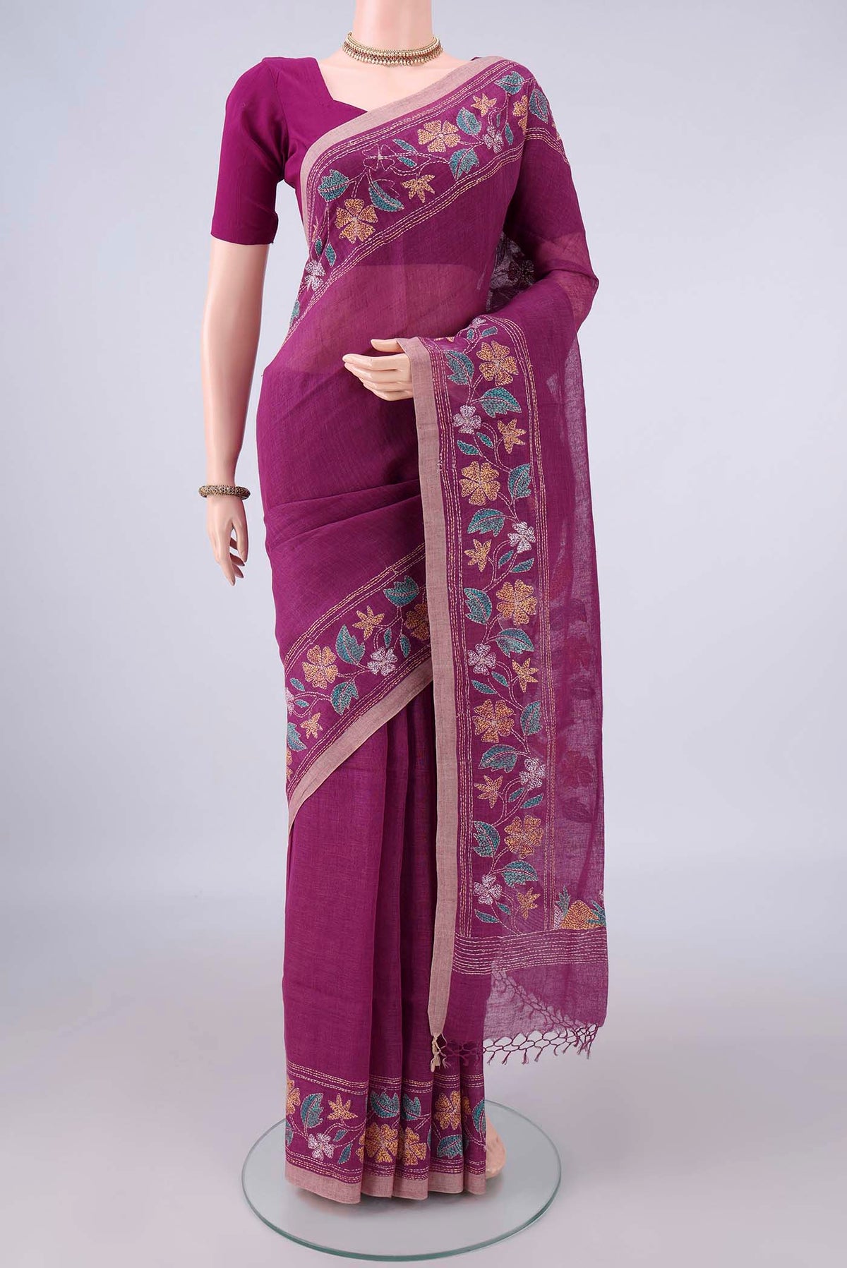 Magenta Linen Saree with Kantha Work on the body and Thread Border.  displayed on a mannequin