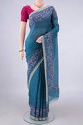 Blue Linen Saree with Plain Body and Plain Border.  displayed on a mannequin