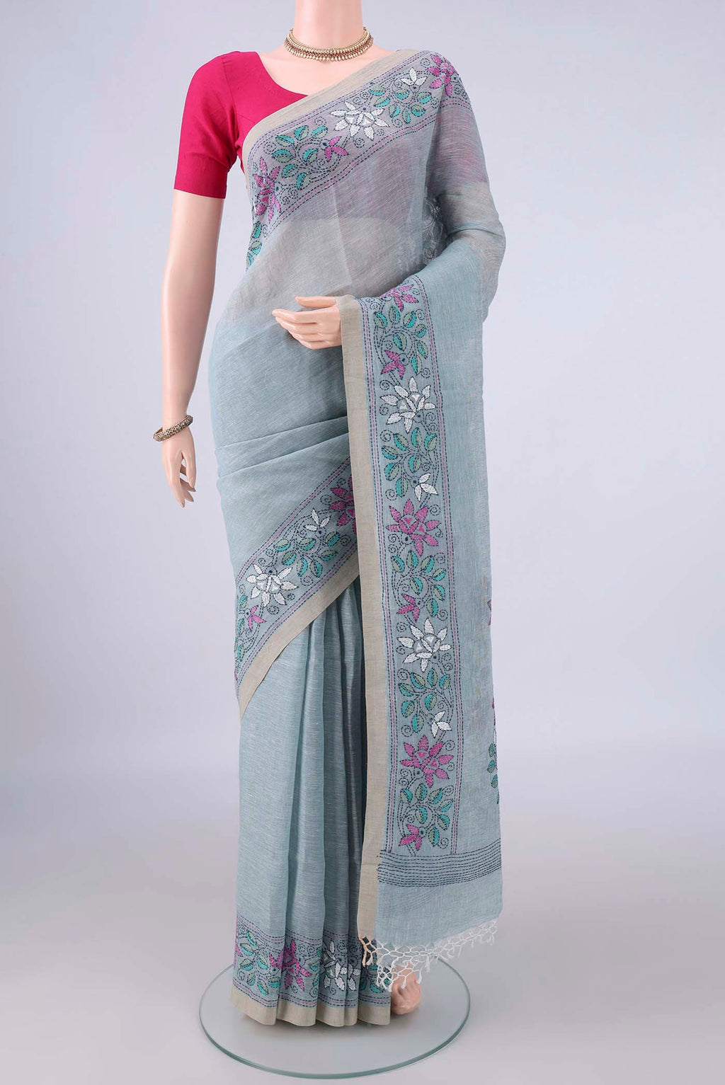 Sky Blue Linen Saree with Plain Body and Thread Border.  displayed on a mannequin