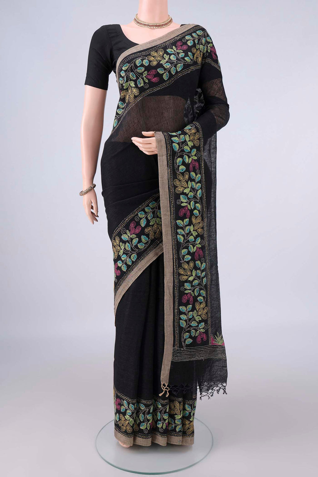 Black Linen Saree with Plain Body and Thread Border.  displayed on a mannequin