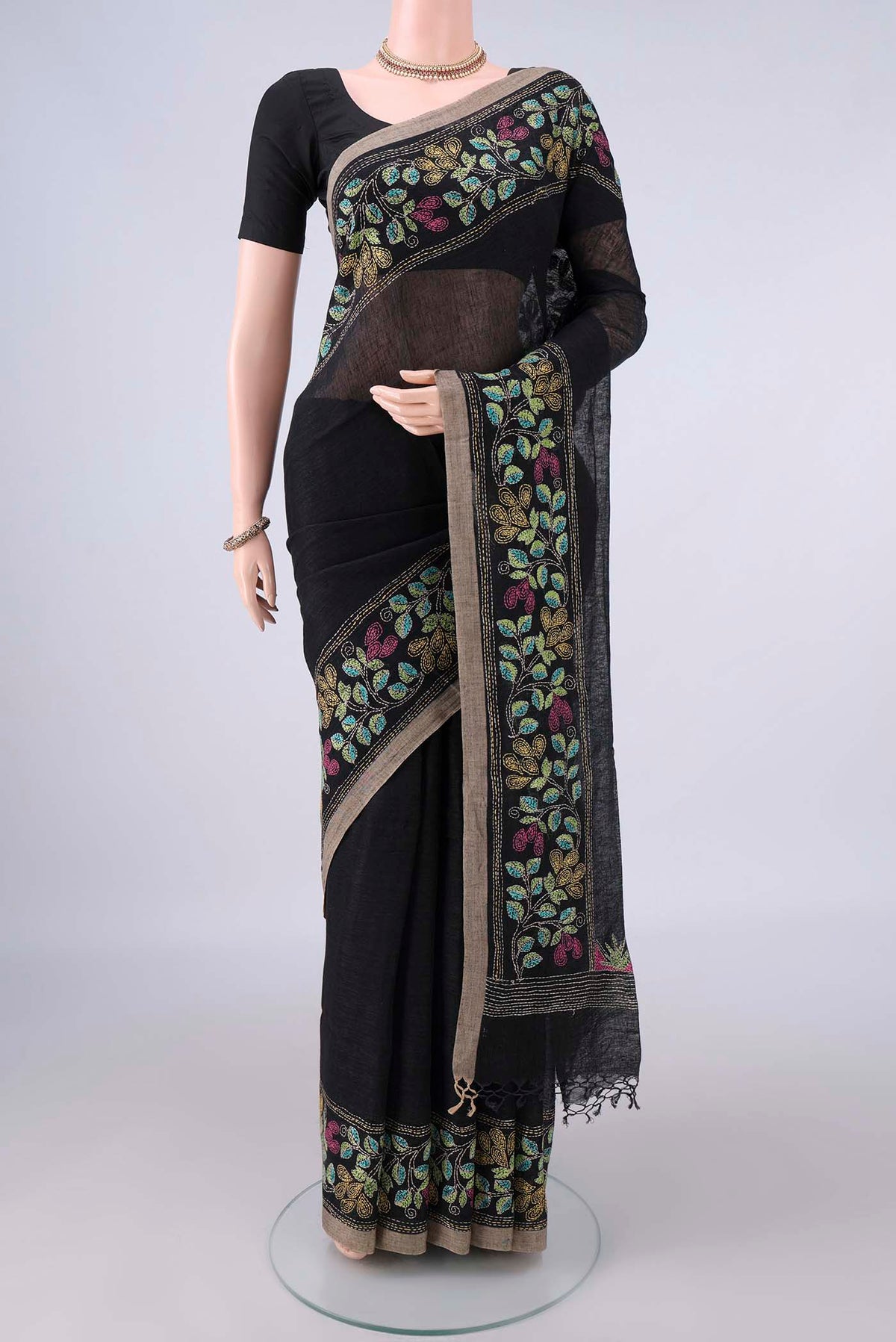 Black Linen Saree with Plain Body and Thread Border.  displayed on a mannequin