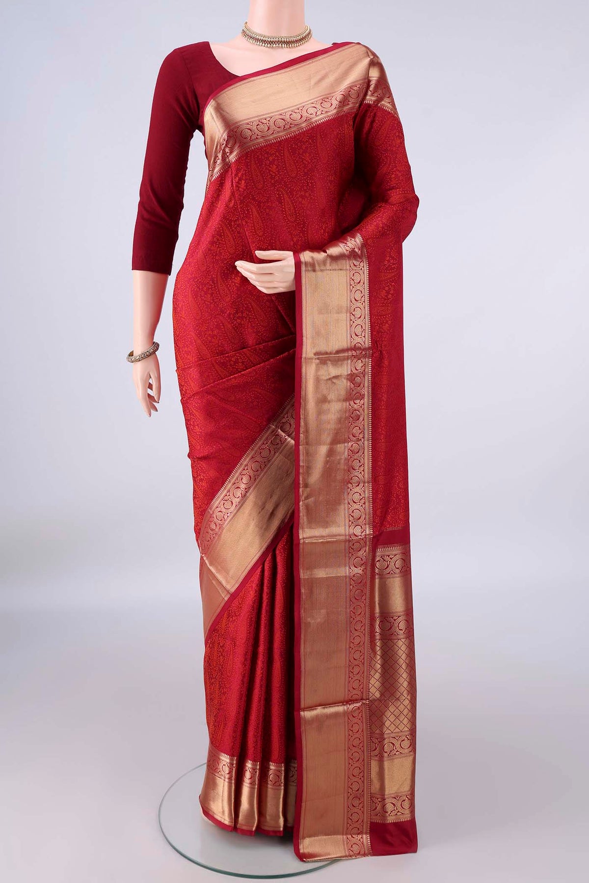 Pure Silk Deep Red Soft Saree with Jacquard design on the body and Zari Border.  displayed on a mannequin