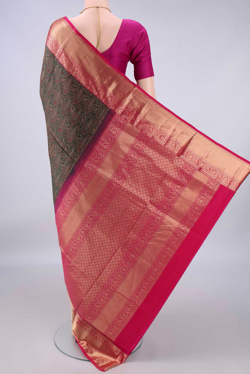 Flat view of Pure Silk Bottle Green Soft Saree with Jacquard design on the body and Zari Border. 