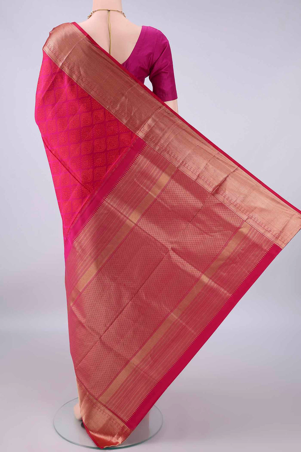 Flat view of Pure Silk Rani Pink Soft Saree with Jacquard design on the body and Zari Border. 