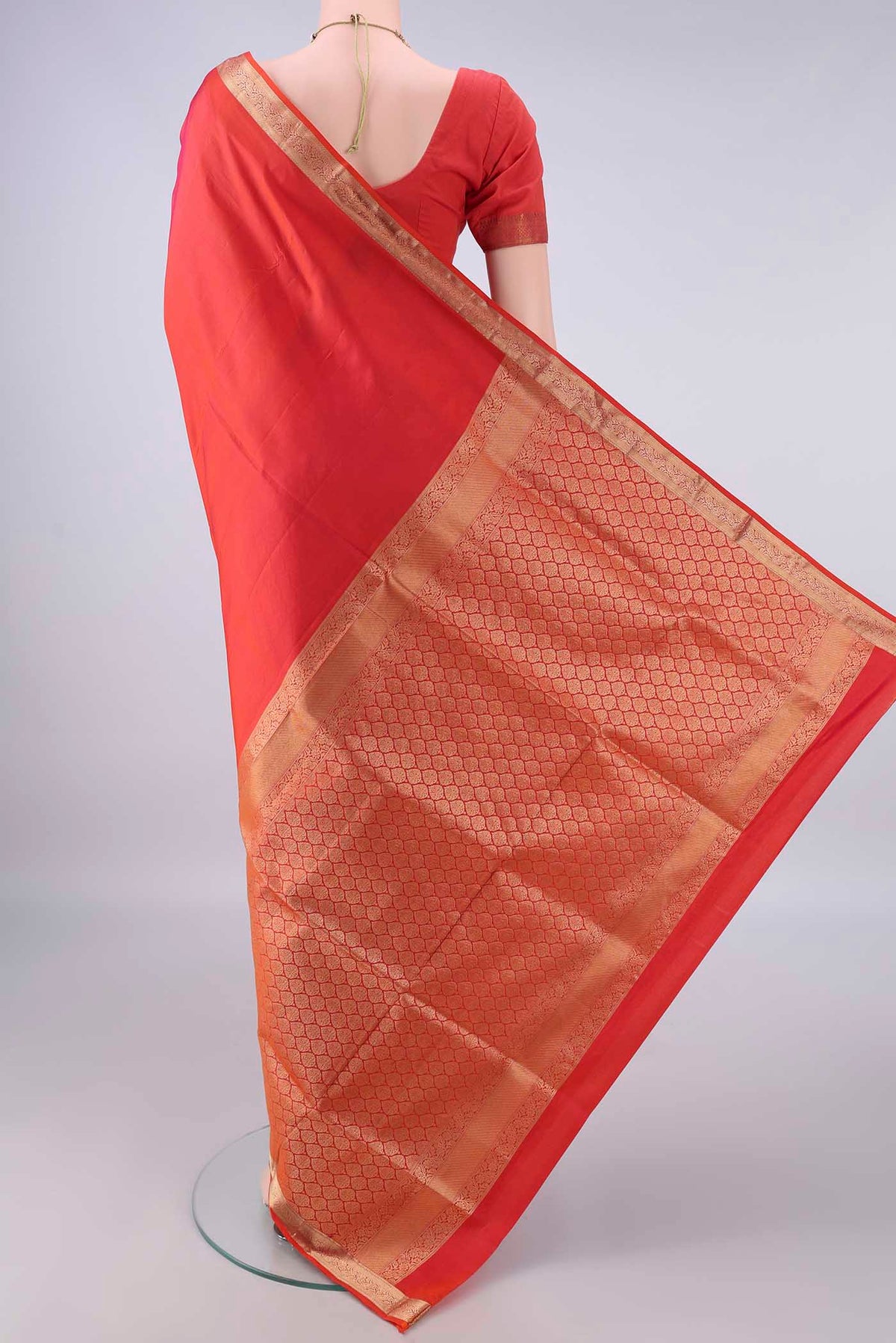 Flat view of Pure Silk Brick Orange Soft Saree with Plain Body and Zari Border. 