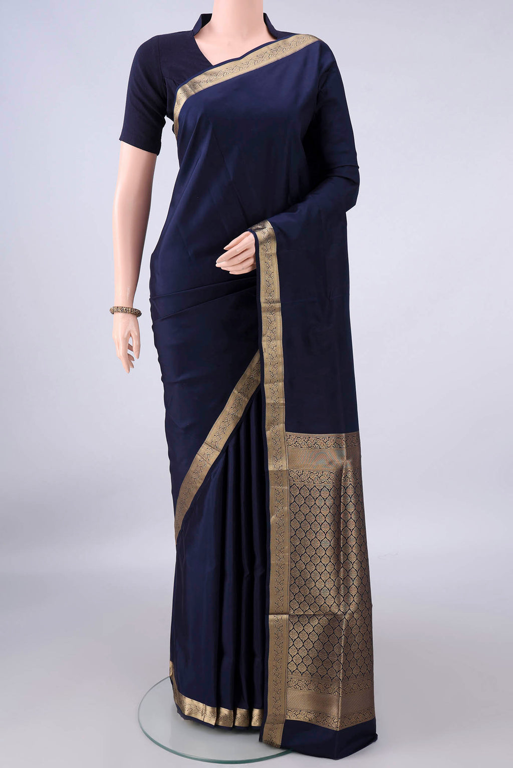 Pure Silk Navy Blue Soft Saree with Plain Body and Zari Border.  displayed on a mannequin