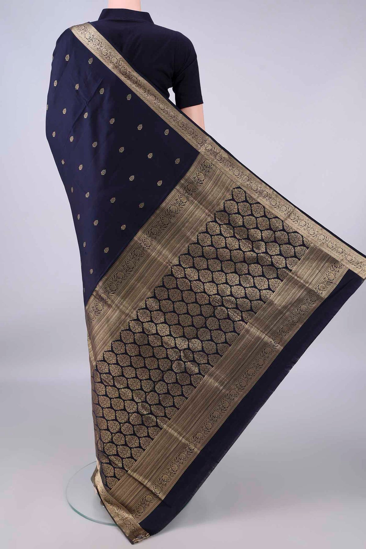 Flat view of Pure Silk Navy Blue Soft Saree with Zari Butta on the body and Zari Border. 