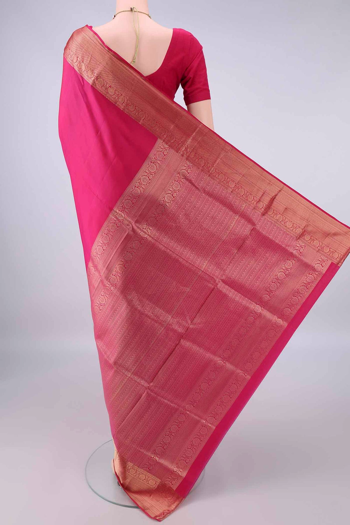 Flat view of Pure Silk Rani Pink Soft Saree with Plain Body and Zari Border. 