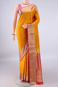 Pure Silk Mustard Soft Saree with Zari Butta on the body and Zari Border.  displayed on a mannequin