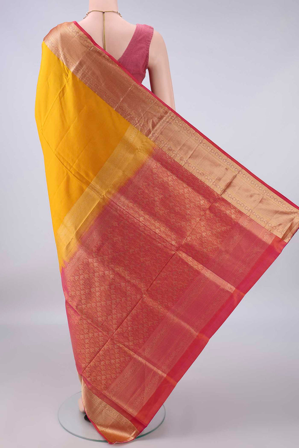 Flat view of Pure Silk Mustard Soft Saree with Zari Butta on the body and Zari Border. 