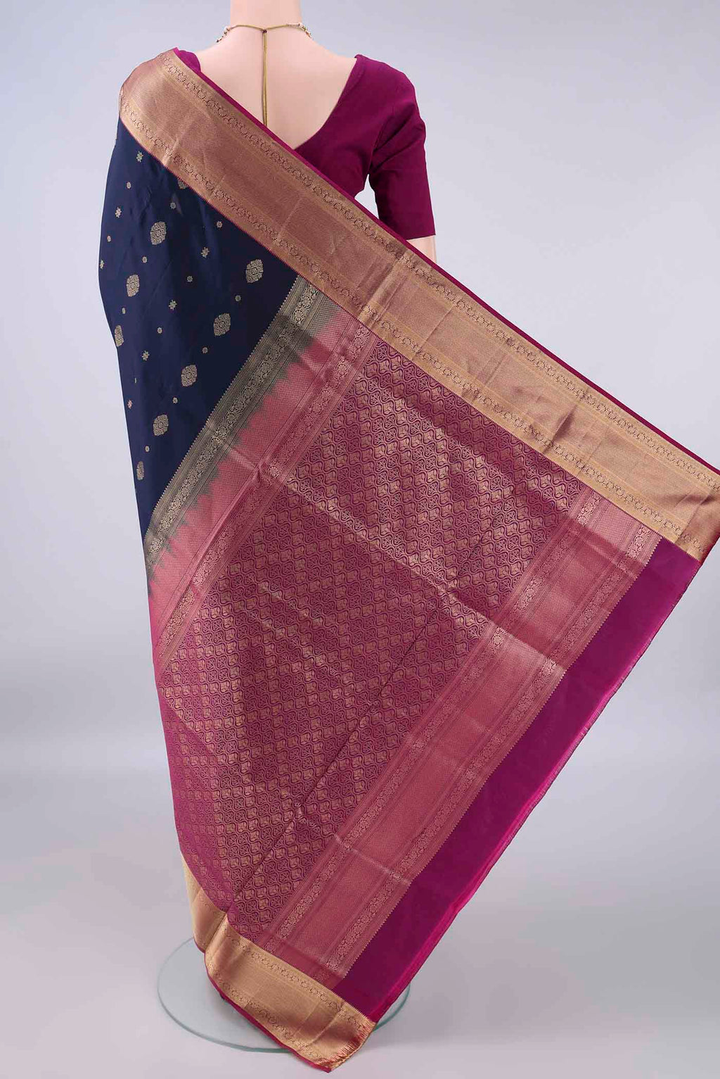Flat view of Pure Silk Navy Blue Soft Saree with Zari Butta on the body and Zari Border. 