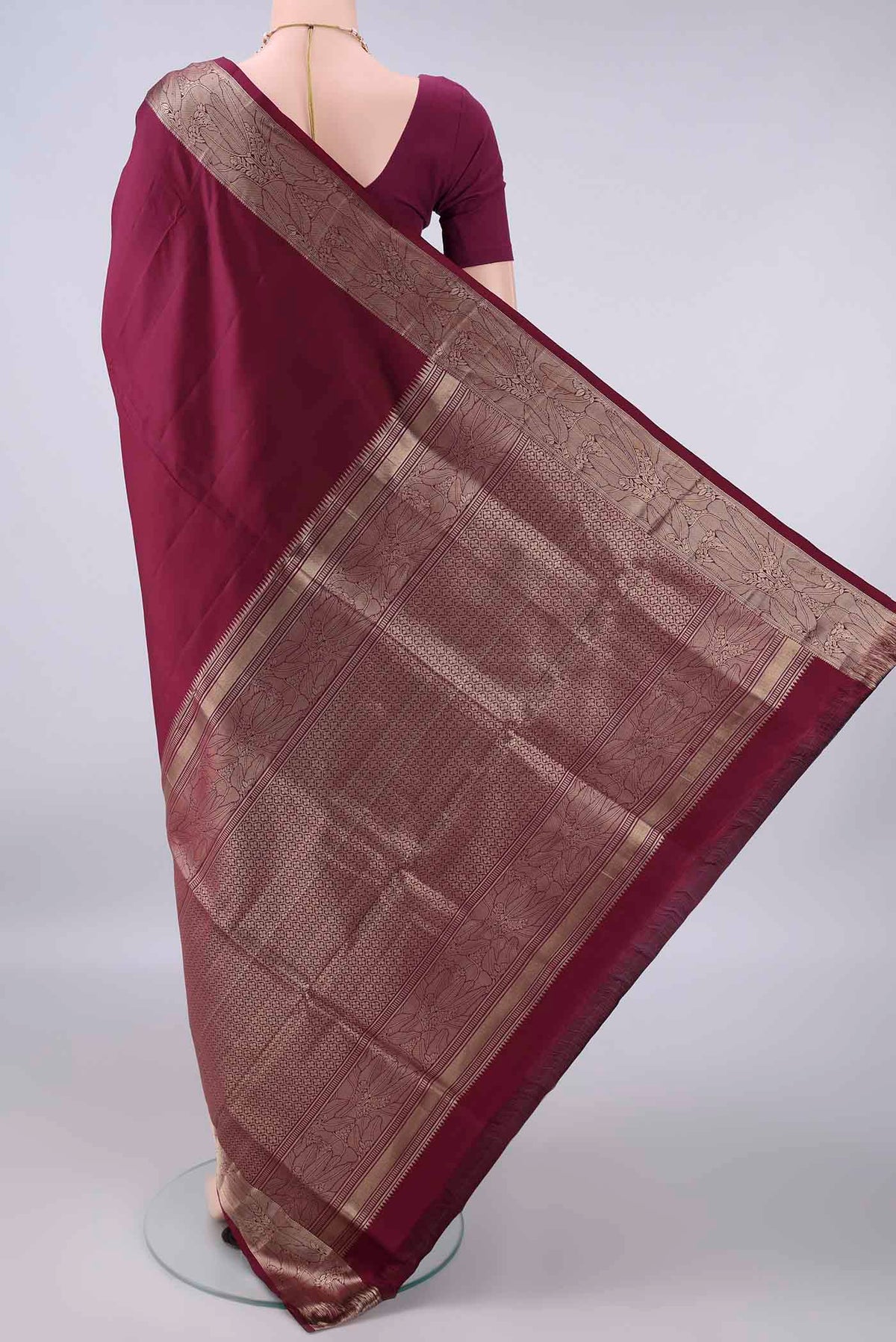 Flat view of Pure Silk Maroon Soft Saree with Plain Body and Zari Border. 