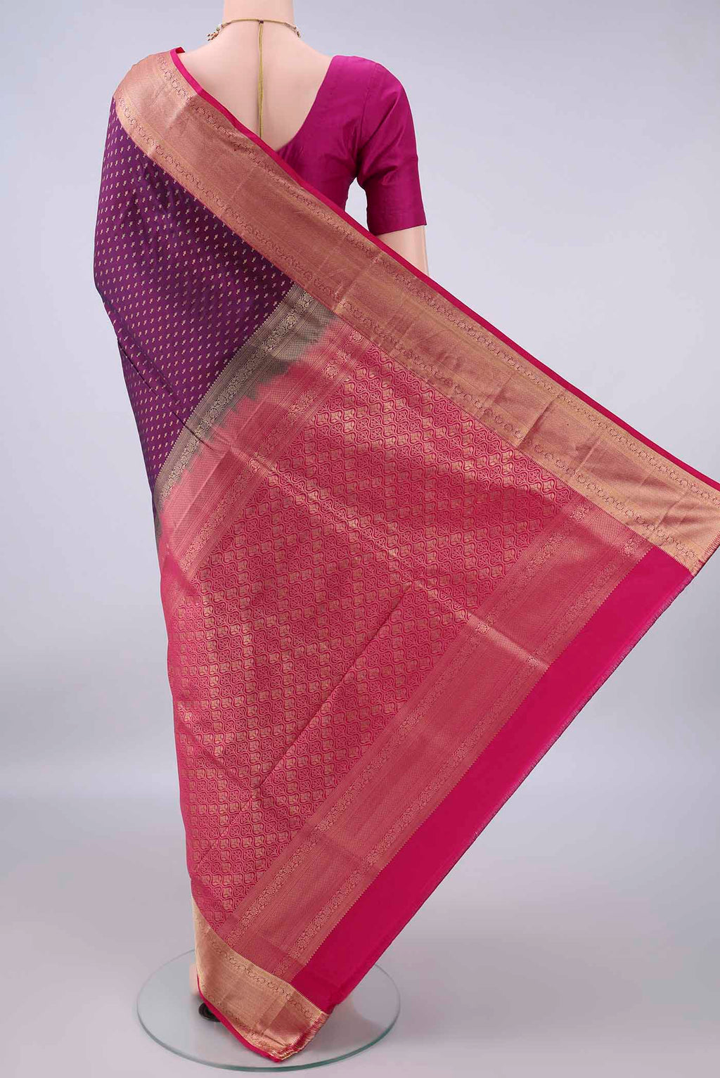 Flat view of Pure Silk Purple Soft Saree with Zari Butta on the body and Zari Border. 