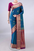 Pure Silk Peacock Blue Soft Saree with Jacquard design on the body and Zari Border.  displayed on a mannequin