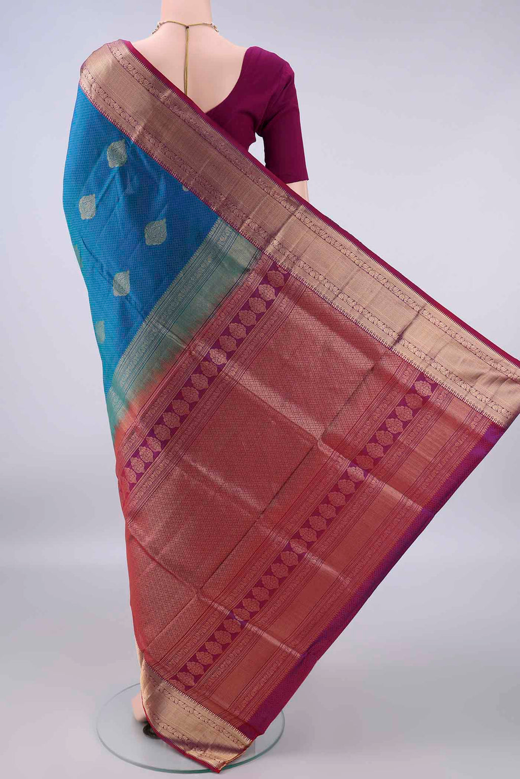 Flat view of Pure Silk Peacock Blue Soft Saree with Jacquard design on the body and Zari Border. 