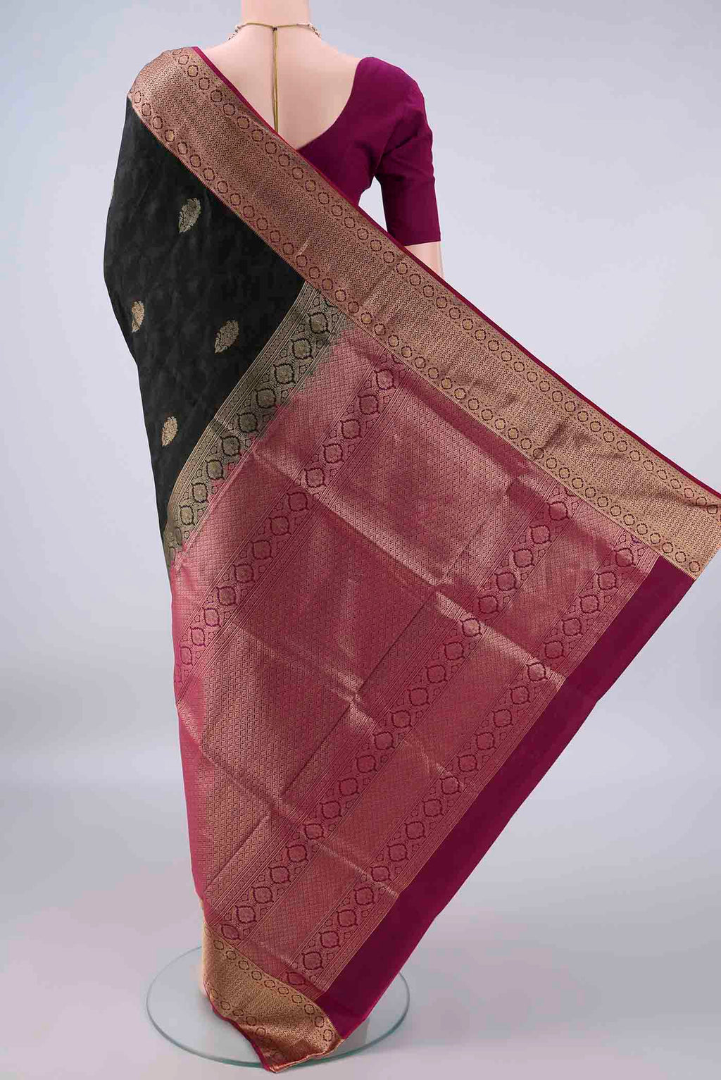 Flat view of Pure Silk Black Soft Saree with Jacquard design on the body and Zari Border. 