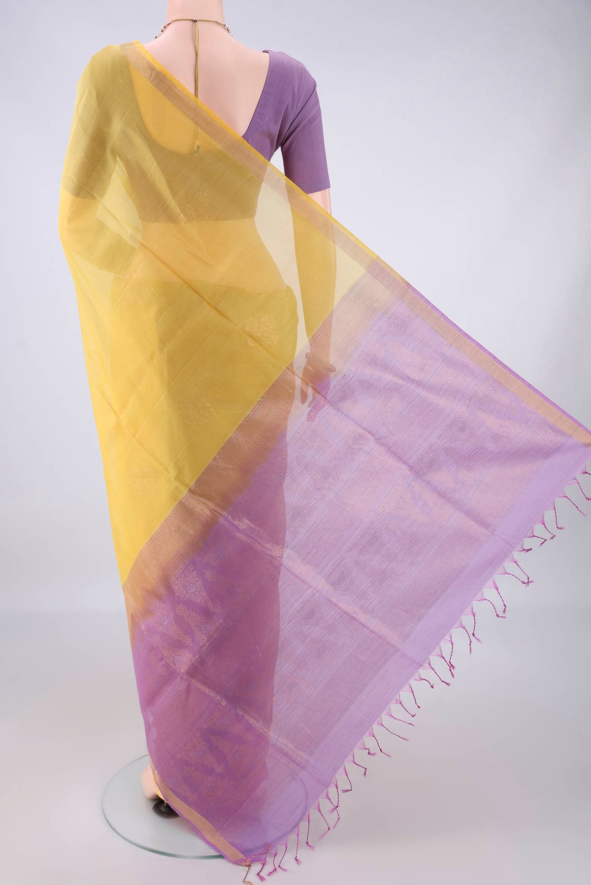 Flat view of Lemon Yellow Silk Cotton Saree with Zari Butta on the body and Zari Border. 