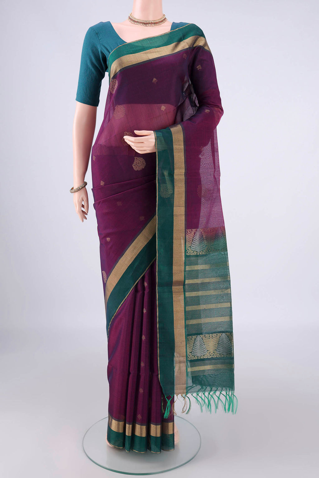 Purple Silk Cotton Saree with Zari Butta on the body and Zari Border.  displayed on a mannequin