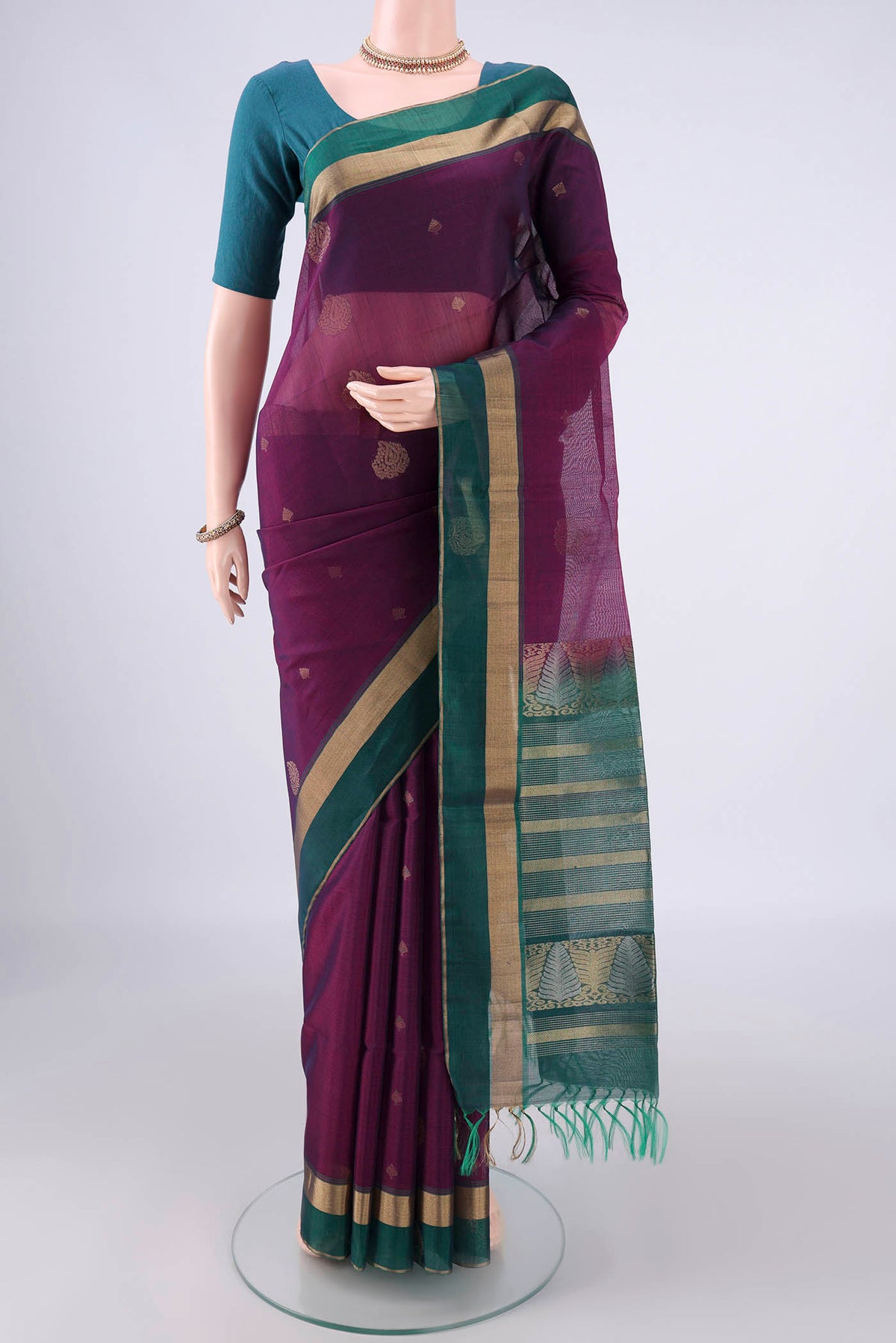 Purple Silk Cotton Saree with Zari Butta on the body and Zari Border.  displayed on a mannequin