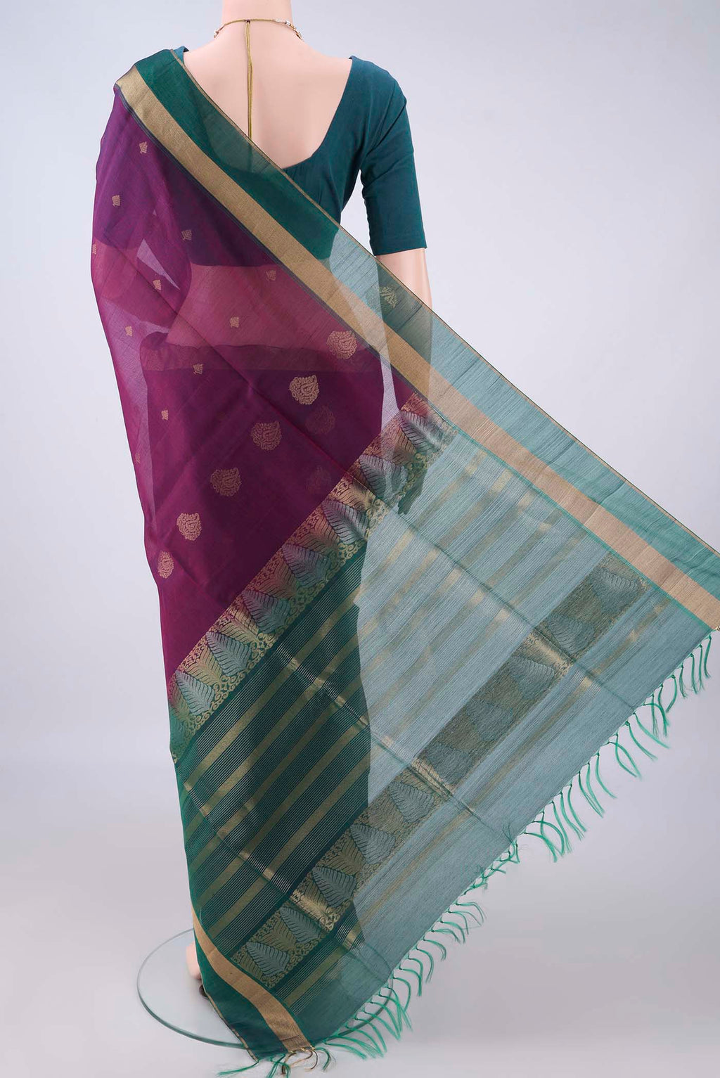 Flat view of Purple Silk Cotton Saree with Zari Butta on the body and Zari Border. 