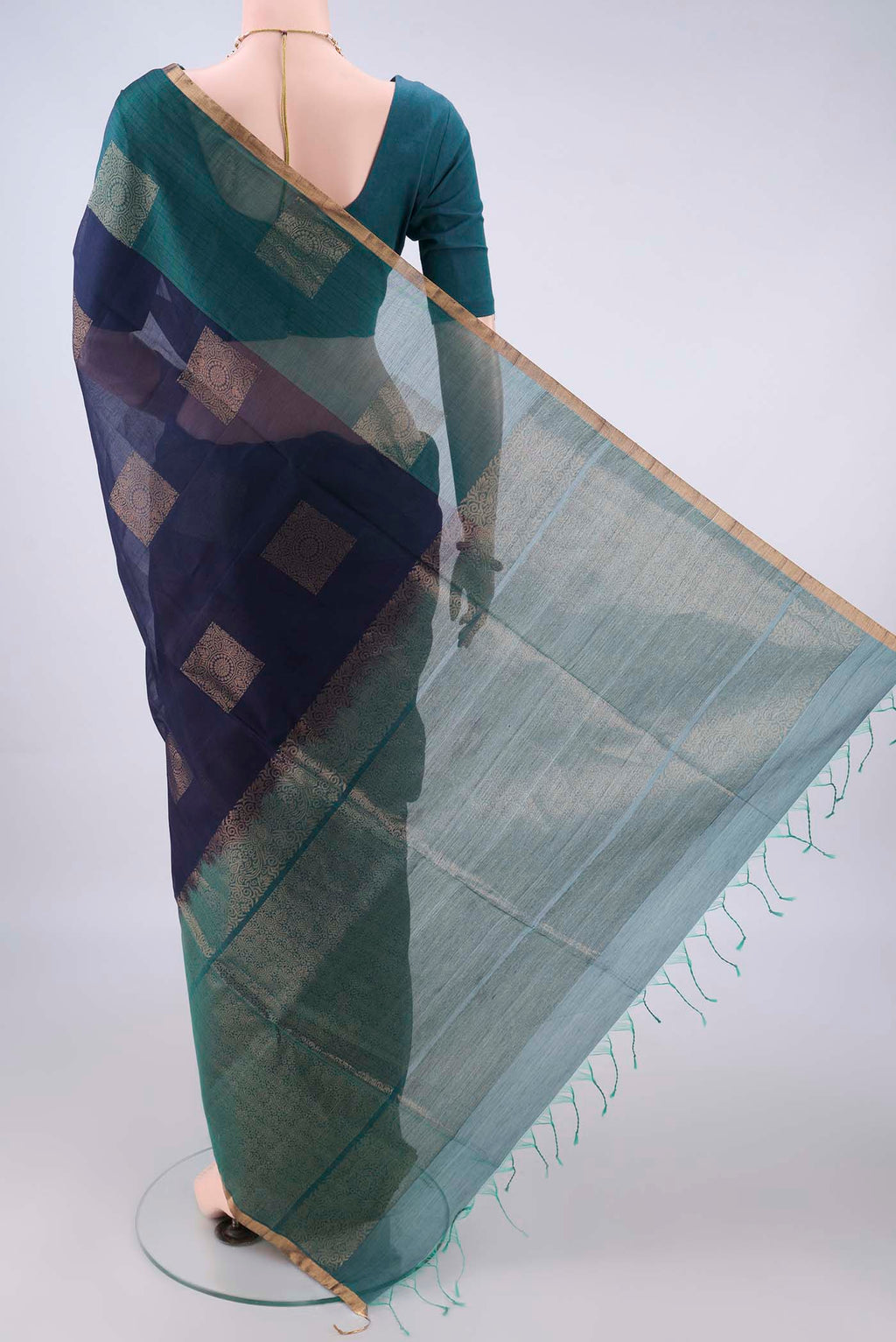Flat view of Navy Blue Silk Cotton Saree with Zari Butta on the body and Plain Border. 
