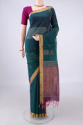 Teal Silk Cotton Saree with Zari Butta on the body and Zari Border.  displayed on a mannequin