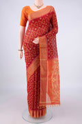 Red Silk Cotton Saree with Ikat design on the body and Zari Border.  displayed on a mannequin